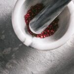 Pink Peppercorn in a Mortar with its Pestle