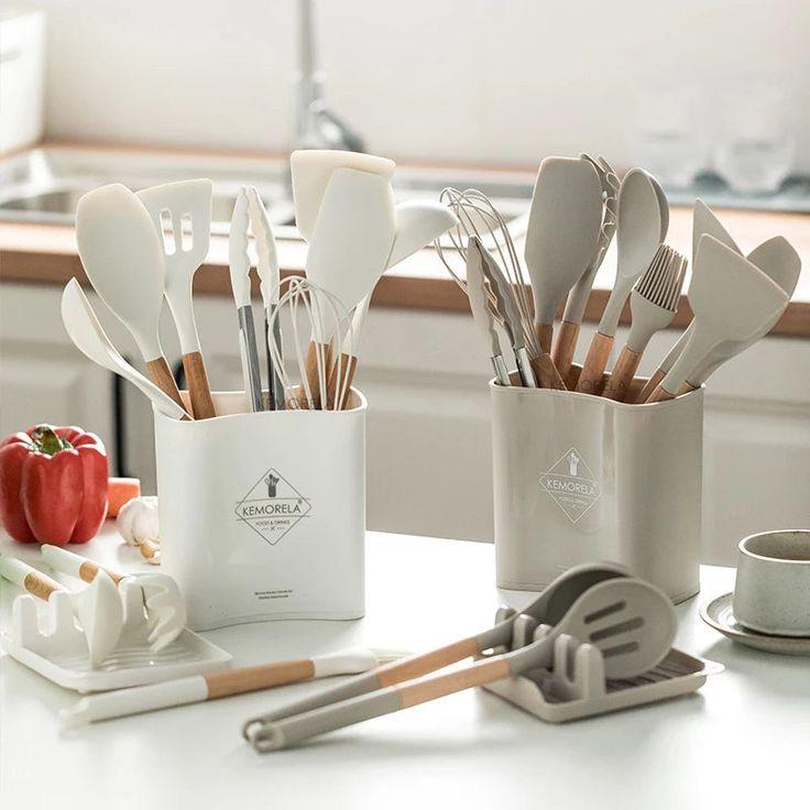 Silicone Kitchen Cookware Set on a kitchen counter with blurred background of the sink