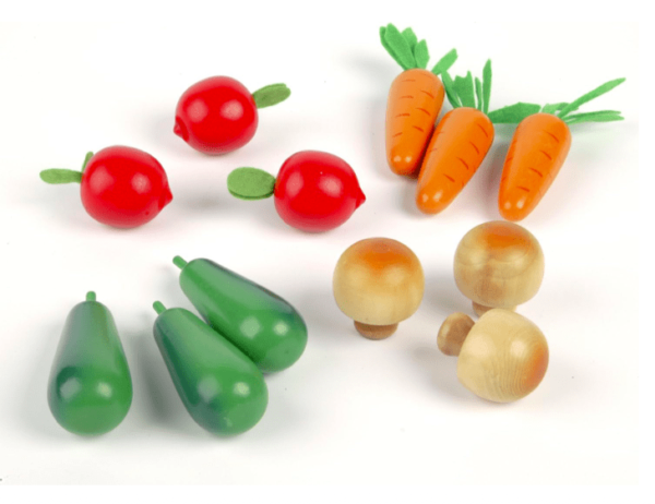 wooden vegetables displayed, three carrots, three tomatoes, three mushrooms and three green pepper