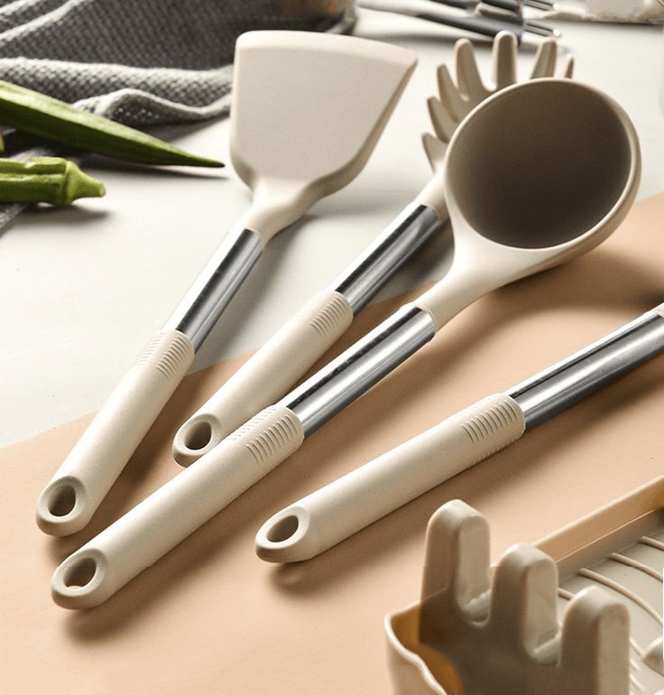 Three pieces of silicone kitchen utensils displayed a soup spoon, spaghetti spoon and flipper 