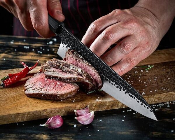 A Chef cutting the meat with Japanese Knife