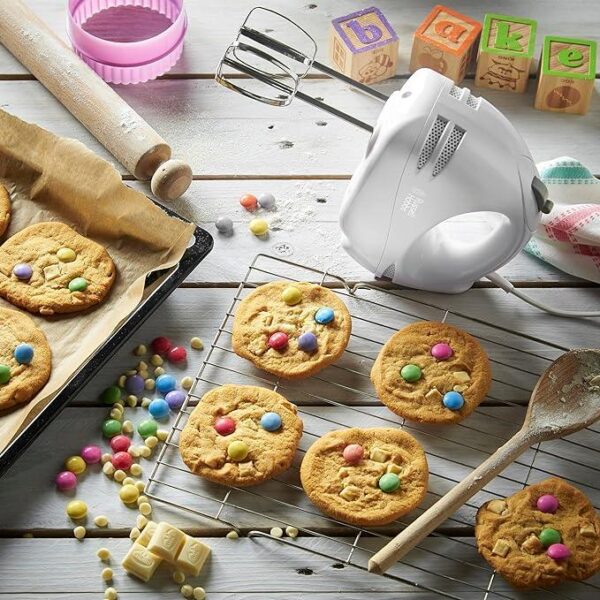 Showing the hand mixer and the cookies that have been baked