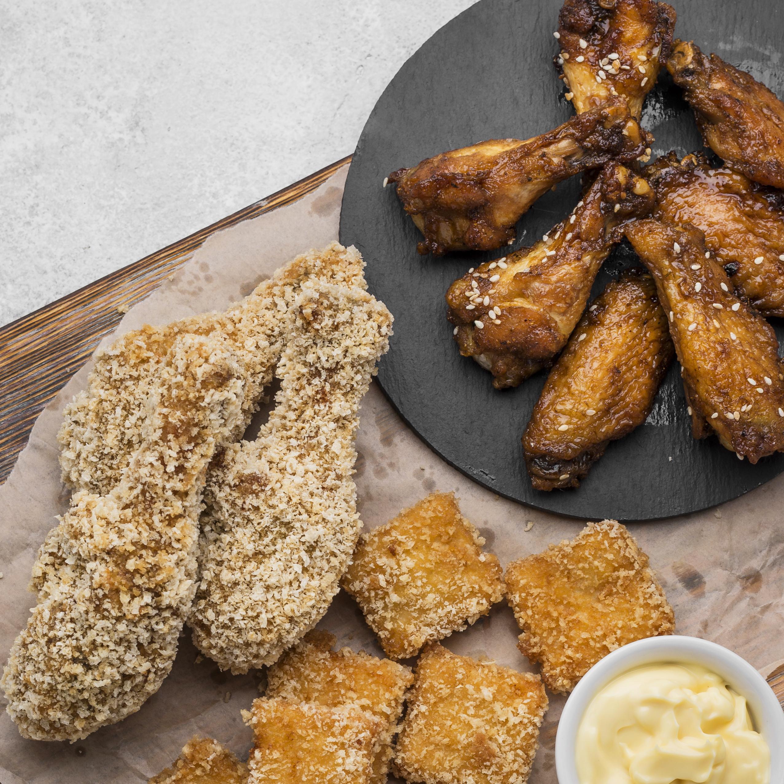 Air fryer chicken with nuggets and sauce on the side