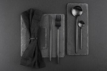 Black Cutlery Set on a black concrete palette and a black handkerchief