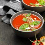 A bowl of tomato and basil soup